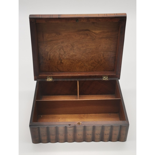 1 - A marquetry wooden sewing box, as a set of books, the hinged cover inlaid with a thimble, scissors, ... 