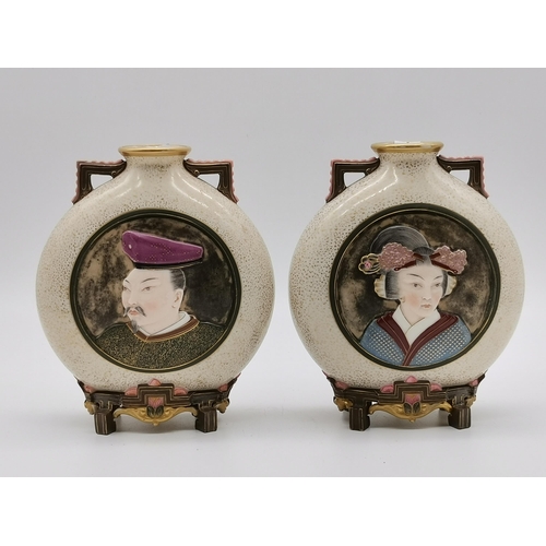 160 - A pair of Royal Worcester porcelain Japanese style moon flask vases, late 19th Century, with speckle... 