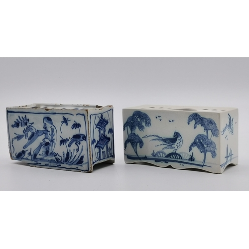 166 - A Delft blue and white flower brick, decorated with a kneeling figure and birds each side, a pagoda ... 