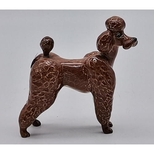 182 - Two Beswick Poodles one white and one BrownCondition StatusGood: In good condition overall, but poss... 