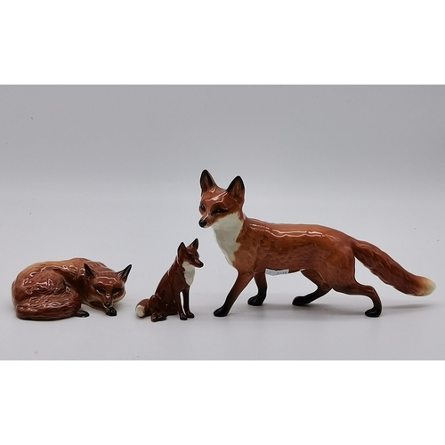 197 - A collection of Beswick animals - Standing Fox, Laying Down Fox 1019, Small sitting fox and 6 brown ... 