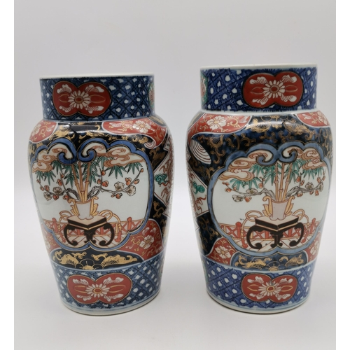 210 - A Pair of Japanese Imari Vases H25.5cm plus one otherCondition StatusGood: In good condition overall... 