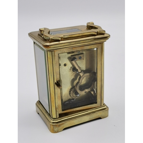 214 - Brass Carriage Clock with key H10.5cmCondition StatusGood: In good condition overall, but possibly s... 