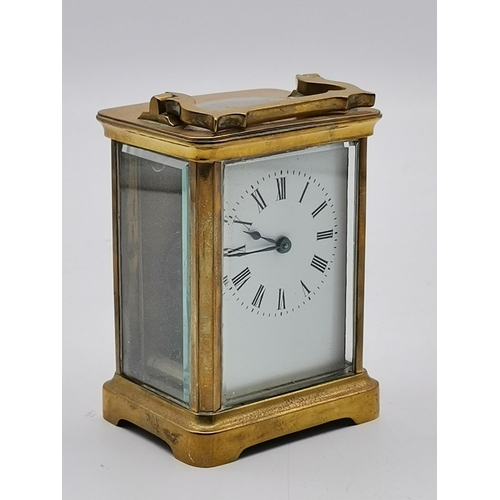 215 - Brass Carriage Clock with key H10.5cmCondition StatusGood: In good condition overall, but possibly s... 