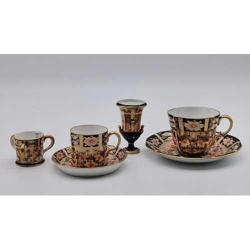 216 - 4 pieces of Royal Crown Derby Imari pattern - Coffee can and saucer, Tea cup and saucer, Miniature p... 