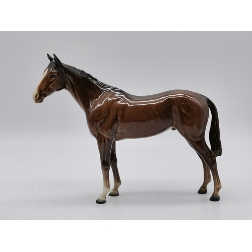 223 - Beswick Two bay horses and Two foalsCondition StatusGood: In good condition overall, but possibly so... 