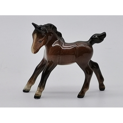 223 - Beswick Two bay horses and Two foalsCondition StatusGood: In good condition overall, but possibly so... 