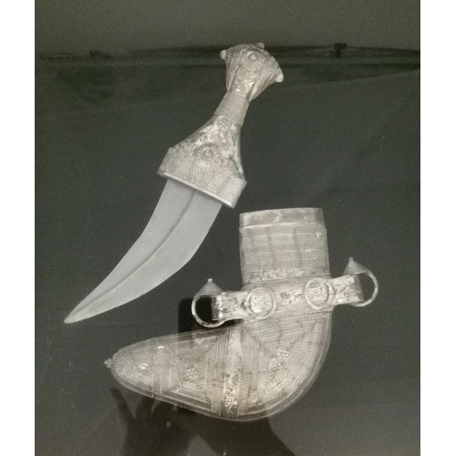 3 - A white metal Omani khanjar, the traditional ceremonial dagger and sheath framed, with presentation ... 