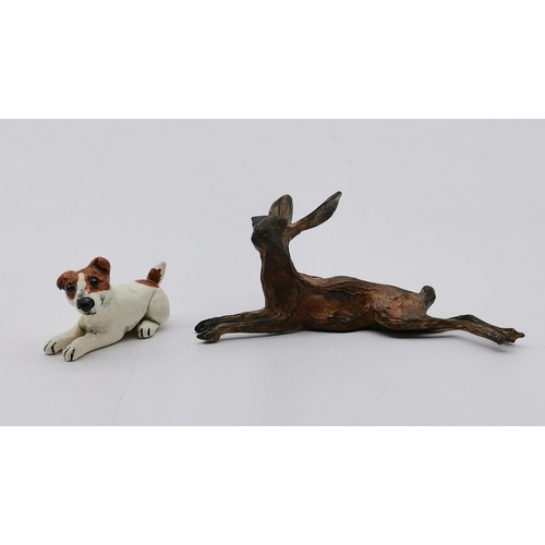 502 - A cold painted bronze hare, modelled lying down, by Michael Storey; together with a vintage small br... 