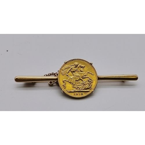 515 - A George V sovereign, 1913, claw-set to an unmarked yellow metal bar brooch. 13.4g gross, 68mm wide