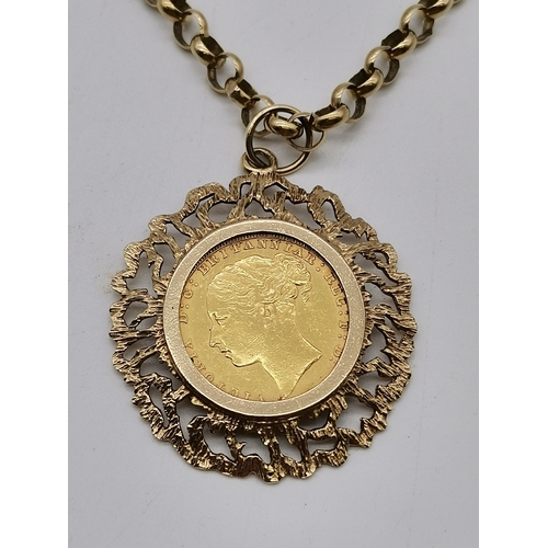 519A - A Victorian sovereign, 1880, loose-mounted to a 9 carat gold pierced and bark-effect pendant mount, ... 