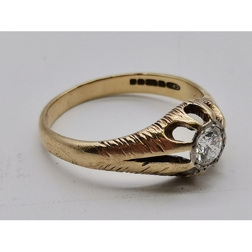 519 - A gent's 9 carat gold solitaire diamond ring, the single stone set to an openwork and split-shoulder... 