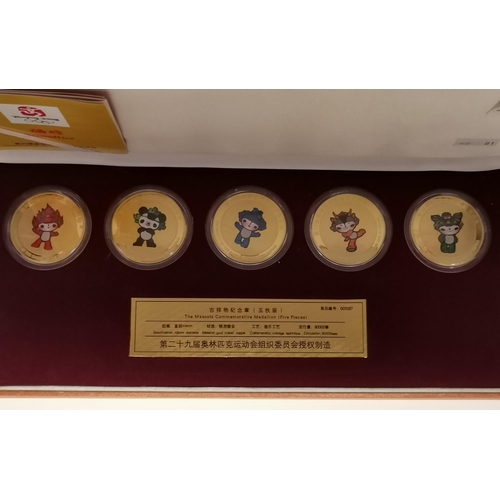 544 - Beijing Olympics 2008, a limited edition set of five gold-plated commemorative Mascot medallions, 'T... 