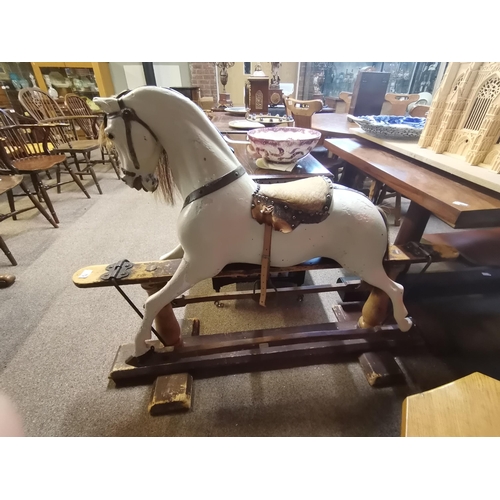 679 - A Victorian pine and painted child's rocking horse 1.3m x 1.1m