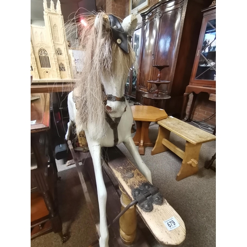 679 - A Victorian pine and painted child's rocking horse 1.3m x 1.1m