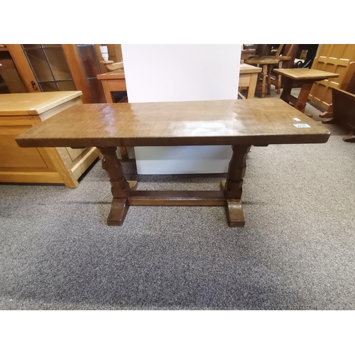 698 - Robert Thompson, a Mouseman oak coffee table, the lightly adzed rectangular top with rounded corners... 