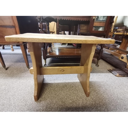 706 - Alan Grainger, an Acornman oak stool, the adzed rounded rectangular top on shaped uprights joined by... 