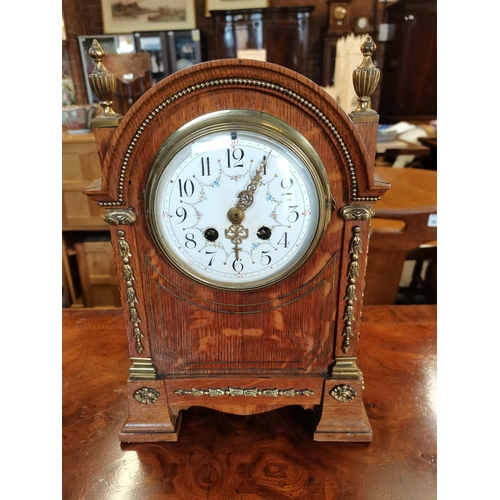 708 - Oak cased mantle clock with brass detailing with key and pendulum