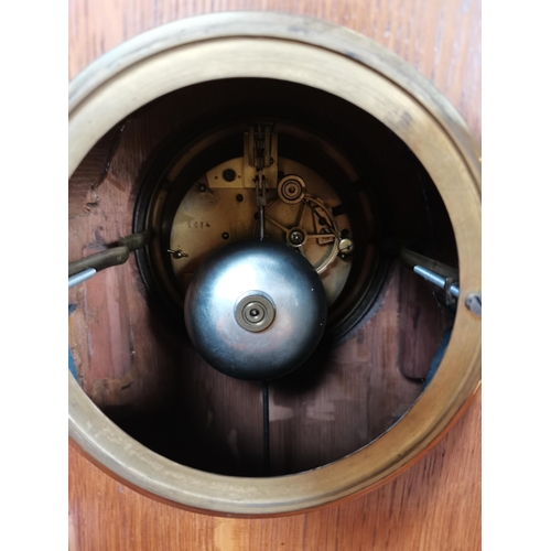 708 - Oak cased mantle clock with brass detailing with key and pendulum