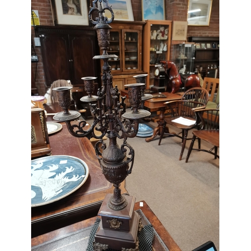 710 - A French marble and spelter clock garniture, 19th Century, the circular cream dial with black Arabic... 