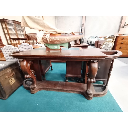 885 - Carved antique Oak hall table with umbrella / cane stands either side L207cm Condition StatusGood: I... 