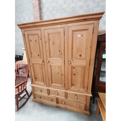 934 - Pine Treble wardrobe sat on 2 over 3 drawers with one shelved compartment and hanging rail in other ... 