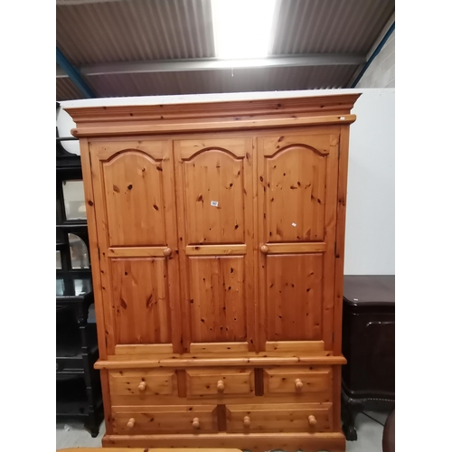 943 - Treble pine wardrobe sat on 2 over 3 drawers with single hanging rail. W153cm x H212cmCondition Stat... 