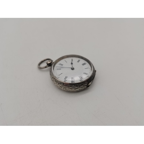 515a - A ladies silver pocket watch, highly engraved to rear of the case