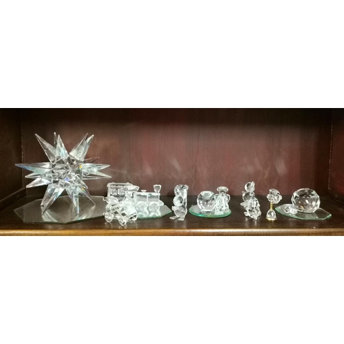 131a - A Large Collection of Swarovski Crystal collectables including animals Train etc