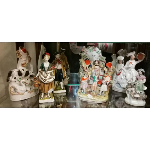 139 - A Collection of Staffordshire figurines plus A pair of Goebel figuresCondition StatusGood: In good c... 