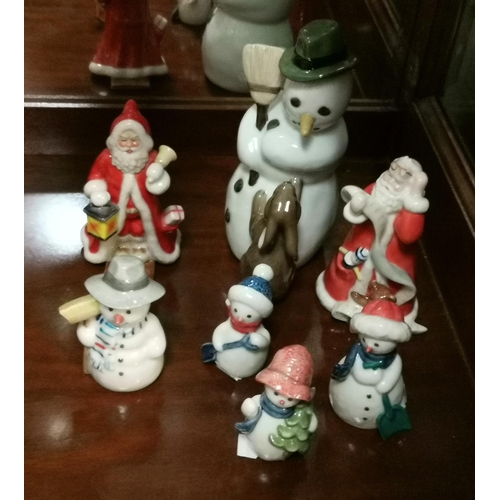 140 - A collection of Royal Copenhagen Christmas figurines including The annual Santa 200 goes skiing, The... 