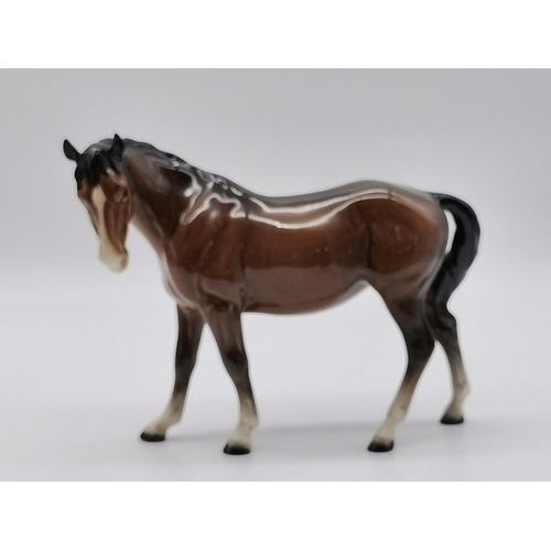 223 - Beswick Two bay horses and Two foalsCondition StatusGood: In good condition overall, but possibly so... 