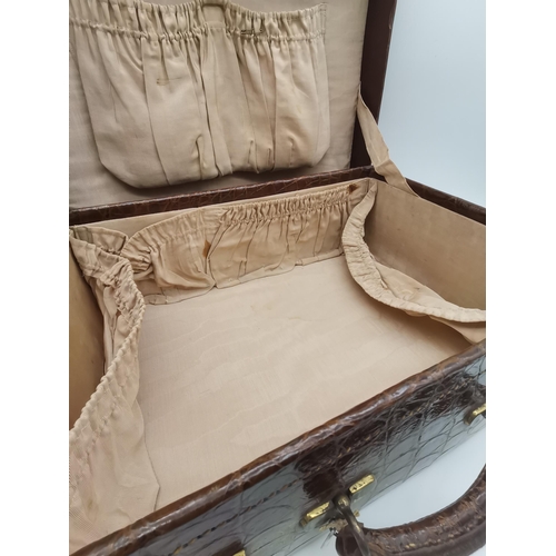 24 - An Antique Leather / poss. crocodile correspondence case plus Vanity case with original case protect... 