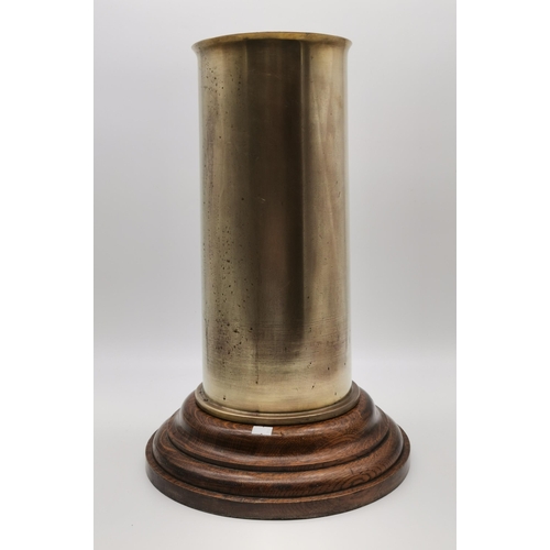 25 - Brass Artillery shell umbrella stand on turned Oak base H48cmCondition StatusVery Good: In good cond... 