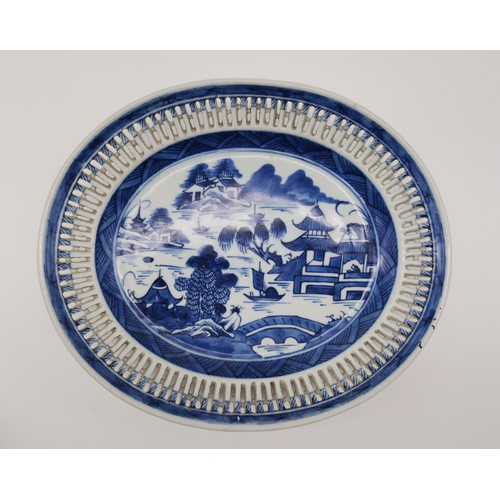 54 - A small collection of assorted blue and white ceramic wares comprising a Delft charger; an oval dish... 