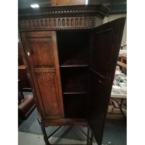 1057A - Antique Oak corner cupboard on barley twist legs