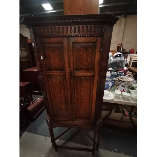 1057A - Antique Oak corner cupboard on barley twist legs