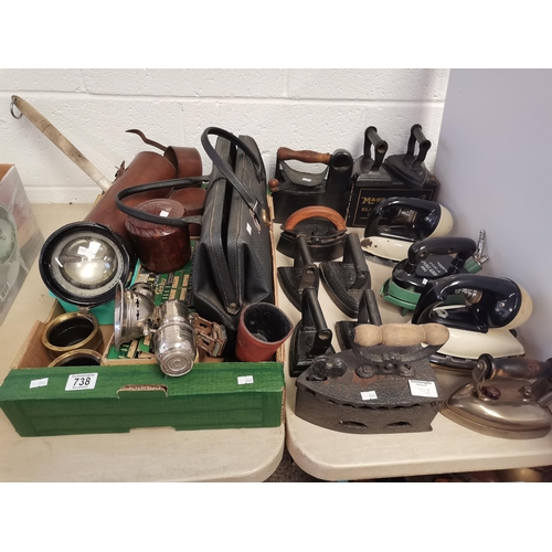 738 - Collection of vintage irons, lights and leather cases