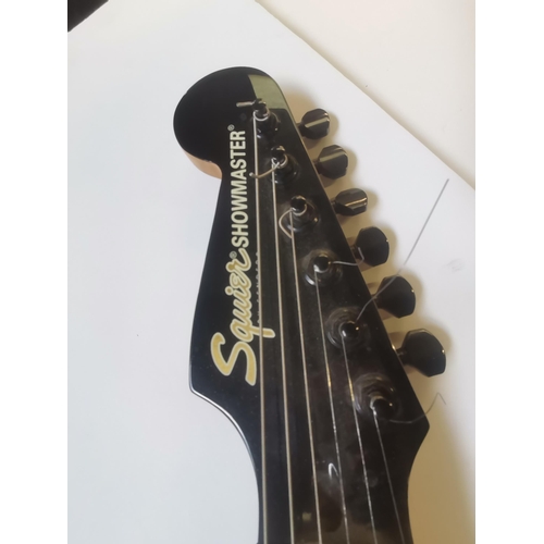 745 - Squier Showmaster by Fender electric guitar Condition StatusGood: In good condition overall, but pos... 