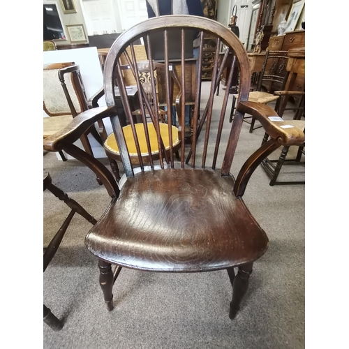 666 - A Windsor chair with unusual curved arms and stick back with turned stretcher