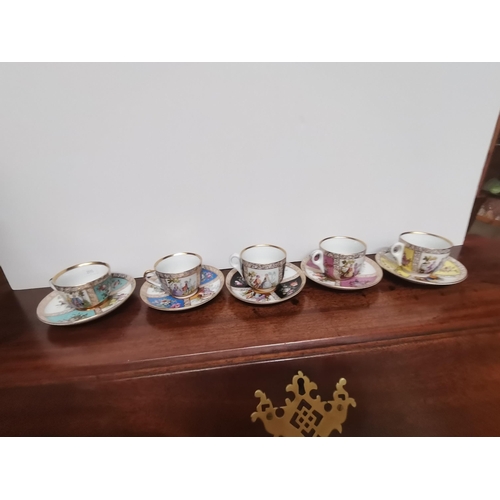 671 - 5 x Dresden small coffee cups in several colours and floral and cherub decoration