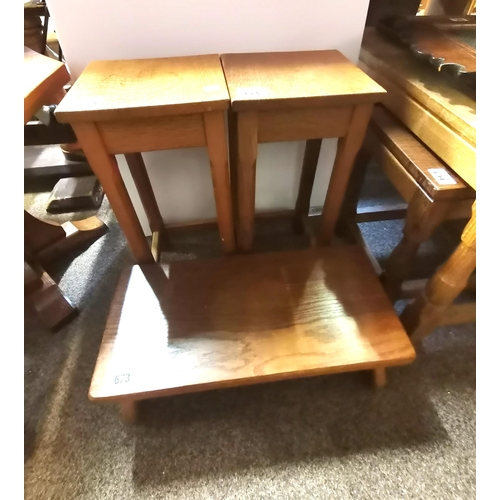 673 - A Yorkshire oak footstool / kneeler, the rounded rectangular plank top raised on shaped uprights, un... 