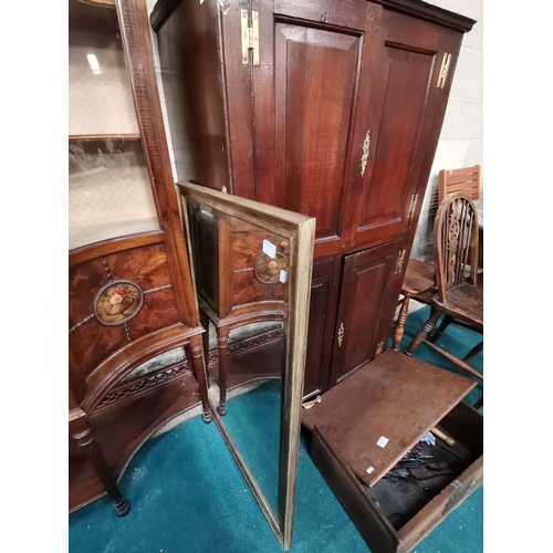 863 - Antique Oak four panelled cupboard with brass fittings W83cm x H143cm x D49cm and bevelled wall mirr... 