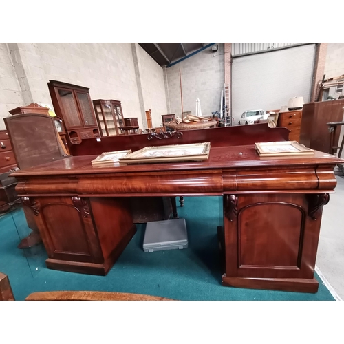 891 - Large Victorian Mahogany sideboard 3 frieze drawers and 2 arched panelled doors, the right hand cupb... 