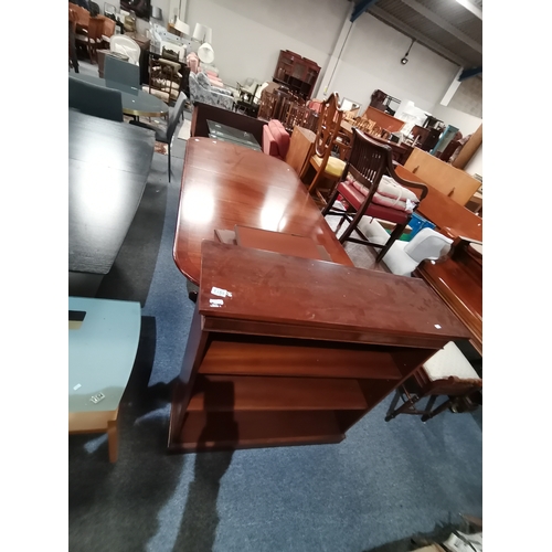 1155 - A modern mahogany extending dining table and similar bookcase