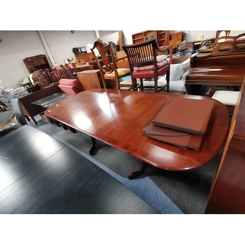 1155 - A modern mahogany extending dining table and similar bookcase