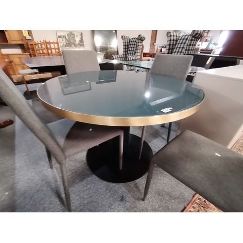 1157 - A GUBI 2.0 dining table and chairs cost new over £2500 1.1m diameter plus 4 chairs diameter 1.2m