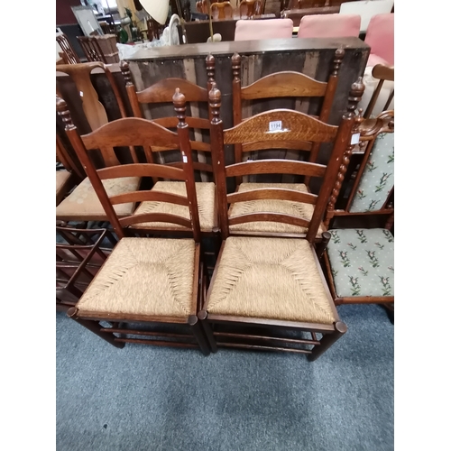 1194 - A set of 4 ladder backed dining chairs with rush seats