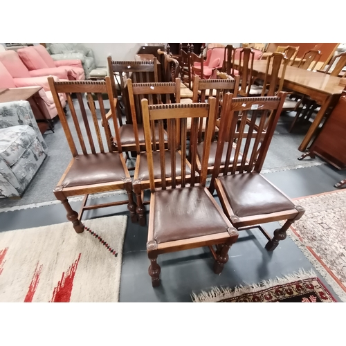 1196 - A set of 6 oak 20th century dining chairs with slat backs, and carving