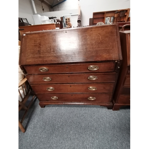 1198 - A Georgian oak bureau with bracket feet and decorative brass handles and a high decorative interior ... 